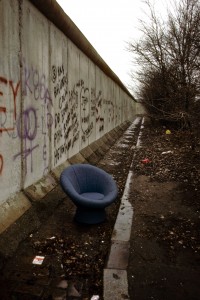 chair beside Berlin Wall