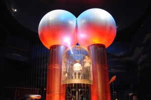 A Van de Graaff generator "zaps" an occupied cage to demonstrate the safety of an enclosed steel struucture.